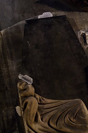 The miniature crystal taxis raced over the unseen roads or the ornate memorials...