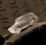 Miniature lead crystal cars invade a London crypt...