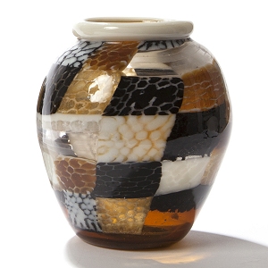 Simple blown glass forms contain the complex and intricate kiln formed honeycomb sections...