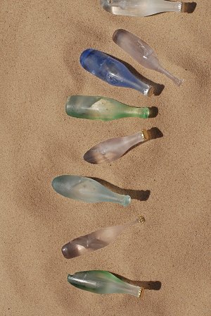 A row of bottles on the tide line...